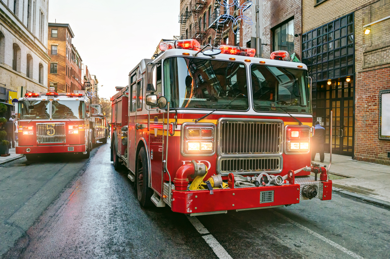 Fire engines driving on the streets of Manhattan, New York