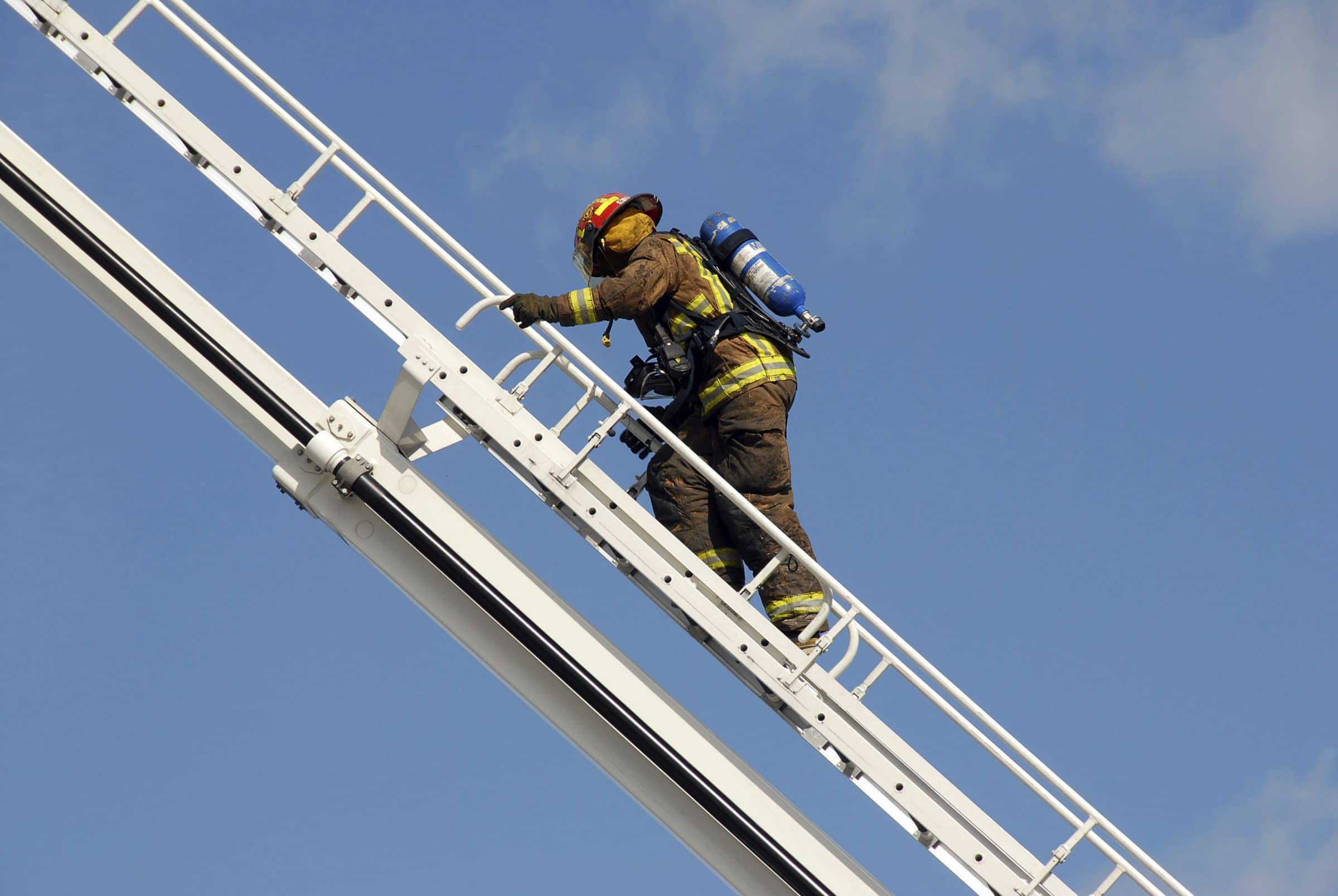Firefighter climbing latter